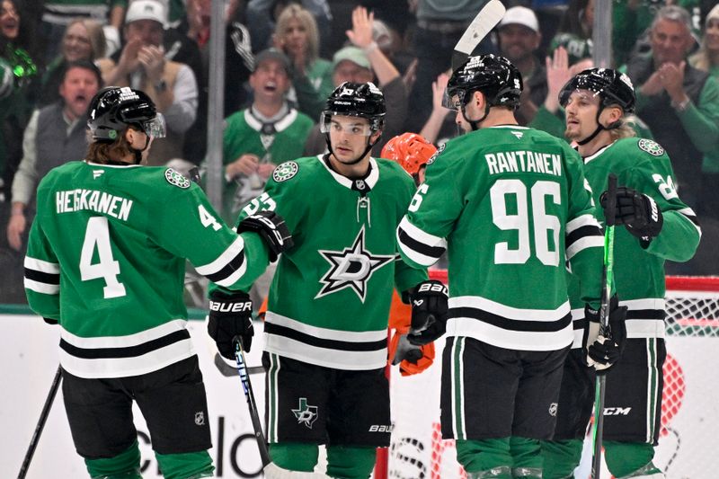 Nov 6, 2025; Dallas, Texas, USA; Dallas Stars defenseman Miro Heiskanen (4) and center Wyatt Johnston (53) and right wing Mikko Rantanen (96) and center Roope Hintz (24) celebrates a power play goal scored by Johnston against the Anaheim Ducks during the first period at the American Airlines Center. Mandatory Credit: Jerome Miron-Imagn Images