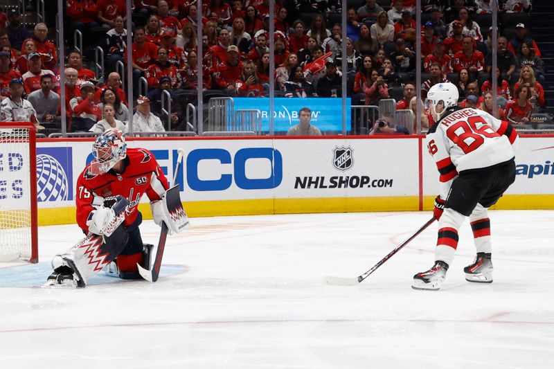 Oct 12, 2024; Washington, District of Columbia, USA; New Jersey Devils center Jack Hughes (86) shoots the puck on Washington Capitals goaltender Charlie Lindgren (79) in the second period at Capital One Arena. Mandatory Credit: Geoff Burke-Imagn Images