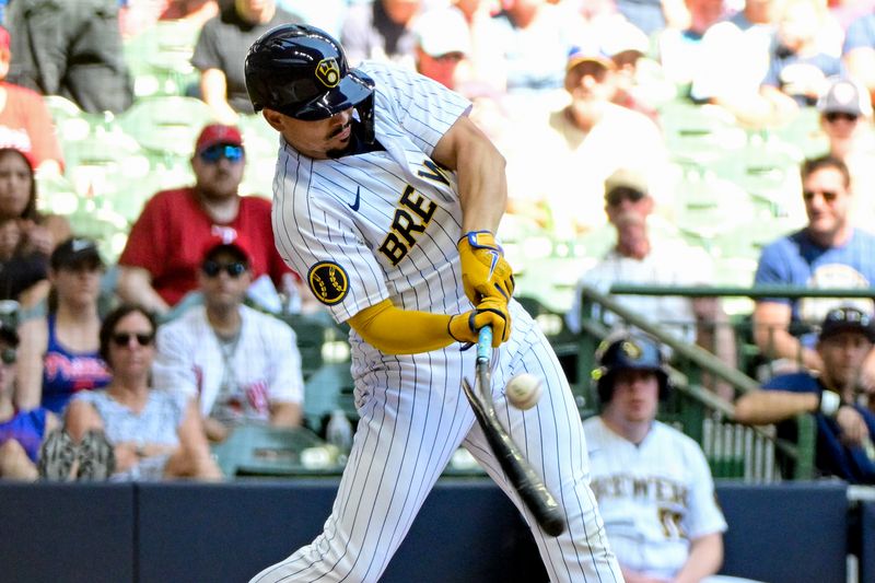 Sep 3, 2023; Milwaukee, Wisconsin, USA; Milwaukee Brewers shortstop Willy Adames (27) breaks his bat while hitting an infield single in the first inning against the Philadelphia Phillies at American Family Field. Mandatory Credit: Benny Sieu-USA TODAY Sports