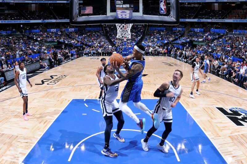 ORLANDO, FL - MARCH 30: Markelle Fultz #20 of the Orlando Magic passes the ball during the game against the Memphis Grizzlies on March 30, 2024 at the Kia Center in Orlando, Florida. NOTE TO USER: User expressly acknowledges and agrees that, by downloading and or using this photograph, User is consenting to the terms and conditions of the Getty Images License Agreement. Mandatory Copyright Notice: Copyright 2024 NBAE (Photo by Fernando Medina/NBAE via Getty Images)