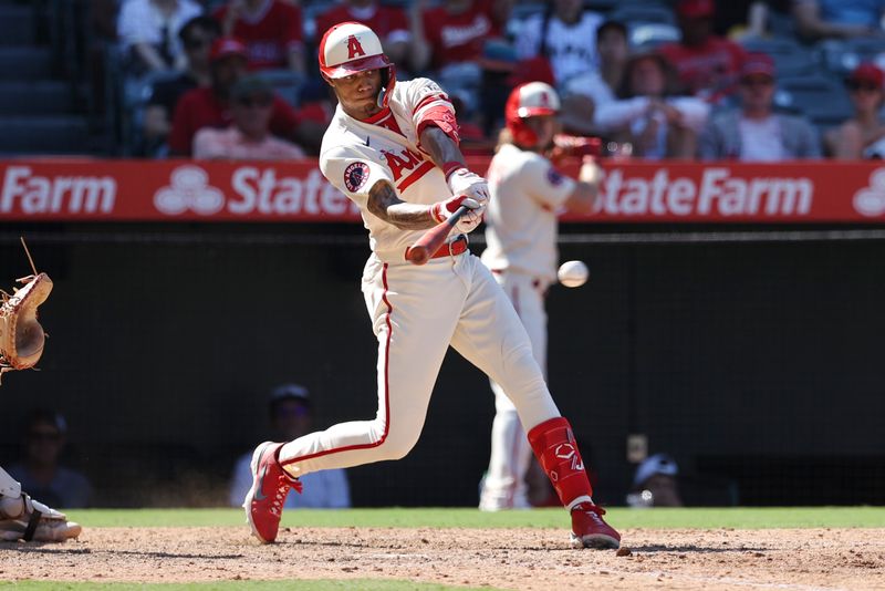 Sep 10, 2023; Anaheim, California, USA; Los Angeles Angels center fielder Jordyn Adams (39) hits a single  against the Cleveland Guardians during the eighth inning  at Angel Stadium. Mandatory Credit: Jessica Alcheh-USA TODAY Sports