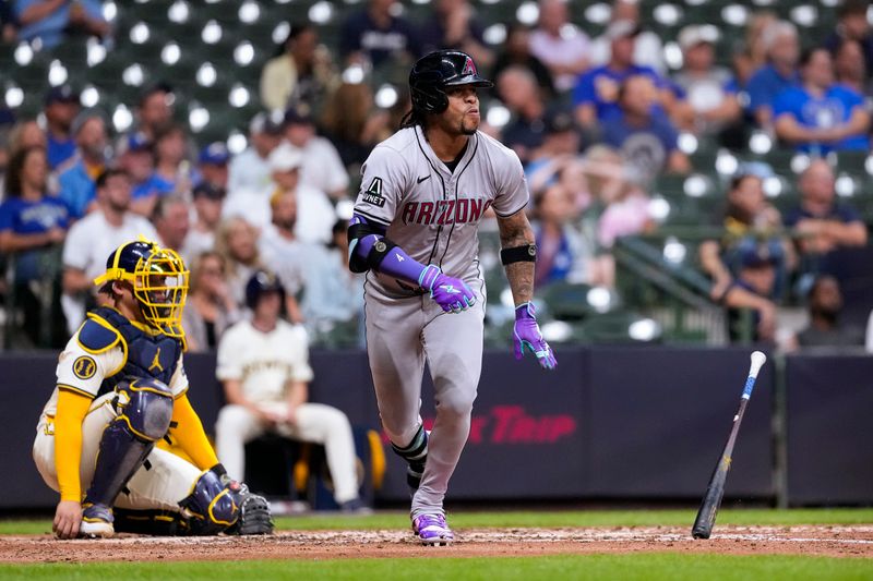 Sep 19, 2024; Milwaukee, Wisconsin, USA;  Arizona Diamondbacks second baseman Ketel Marie (4) hits an RBI single during the fifth inning against the Milwaukee Brewers at American Family Field. Mandatory Credit: Jeff Hanisch-Imagn Images