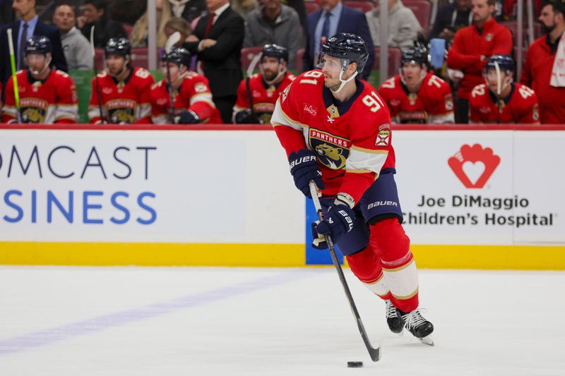 Nov 22, 2023; Sunrise, Florida, USA; Florida Panthers defenseman Oliver Ekman-Larsson (91) moves the puck against the Boston Bruins during the first period at Amerant Bank Arena. Mandatory Credit: Sam Navarro-USA TODAY Sports