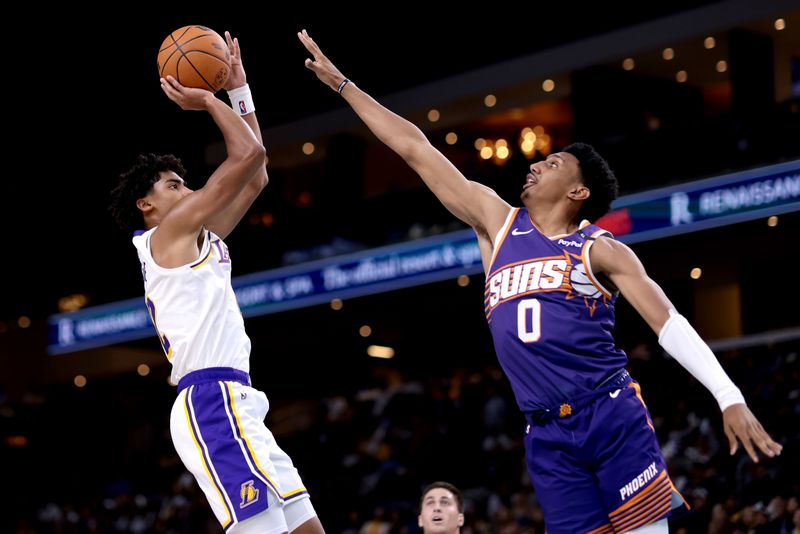 PALM SPRINGS, CALIFORNIA - OCTOBER 06: Max Christie #12 of the Los Angeles Lakers shoots against Ryan Dunn #0 of the Phoenix Suns during the fourth quarter at Acrisure Arena on October 06, 2024 in Palm Springs, California. NOTE TO USER: User expressly acknowledges and agrees that, by downloading and/or using this photograph, user is consenting to the terms and conditions of the Getty Images License Agreement. (Photo by Katelyn Mulcahy/Getty Images)