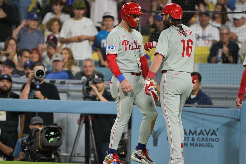 Sep 16, 2025; Los Angeles, California, USA; (Editors Notes:
Caption Correction) Philadelphia Phillies center fielder Brandon Marsh (16) celebrates a three run home run with first baseman Otto Kemp (4) during the sixth inning against the Los Angeles Dodgers at Dodger Stadium. Mandatory Credit: Jayne Kamin-Oncea-Imagn Images
