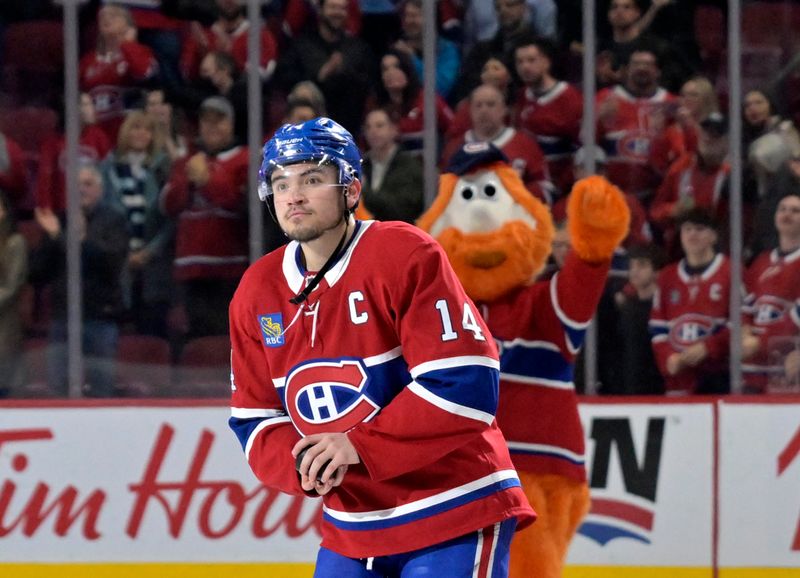 Apr 5, 2025; Montreal, Quebec, CAN; Montreal Canadiens forward Nick Suzuki (14) celebrates the win against the Philadelphia Flyers at the Bell Centre. Mandatory Credit: Eric Bolte-Imagn Images