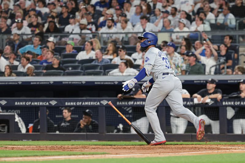 Jun 8, 2024; Bronx, New York, USA;  Los Angeles Dodgers right fielder Teoscar Hernandez (37) looks up at his grand slam home run during the eighth inning against the New York Yankees at Yankee Stadium. Mandatory Credit: Vincent Carchietta-USA TODAY Sports