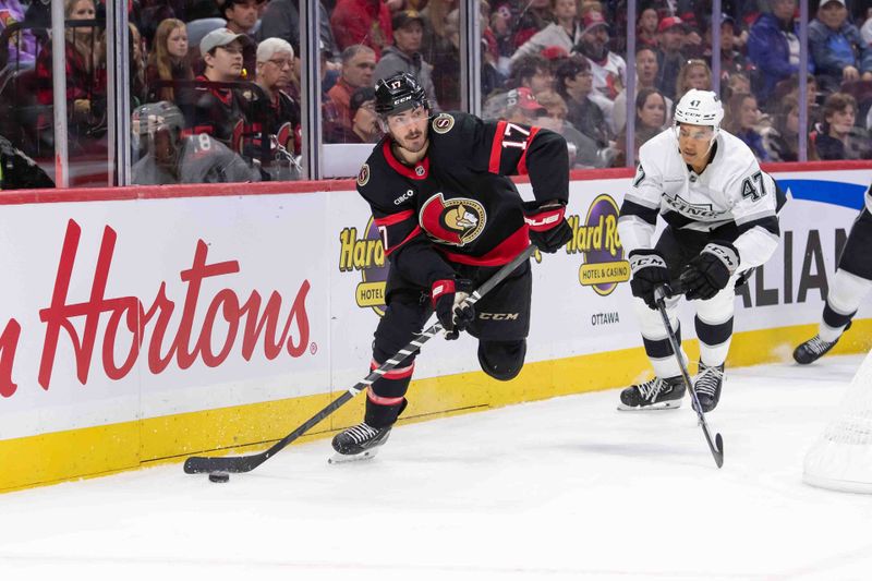 Oct 14, 2024; Ottawa, Ontario, CAN; Ottawa Senators right wing Zack MacEwen (17) moves the puck away from Los Angeles Kings left wing Andre Lee (47) in the first period at the Canadian Tire Centre. Mandatory Credit: Marc DesRosiers-Imagn Images