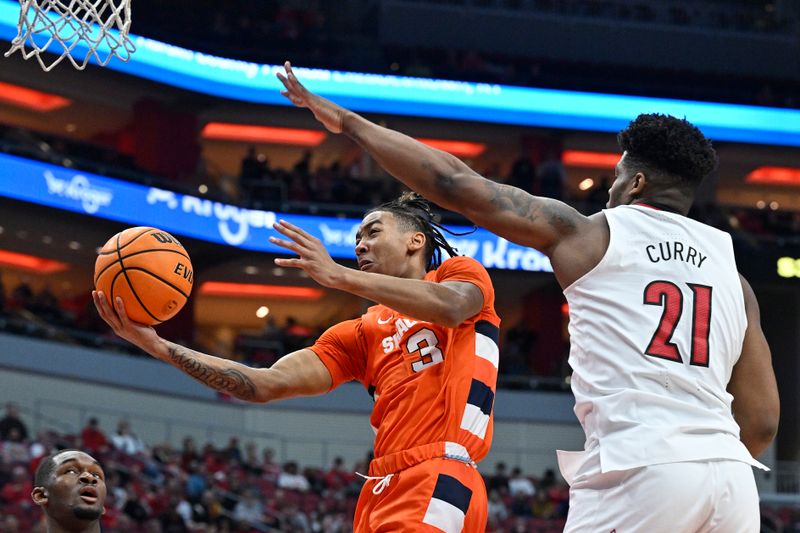 Jan 3, 2023; Louisville, Kentucky, USA; Syracuse Orange guard Judah Mintz (3) shoots against Louisville Cardinals forward Sydney Curry (21) during the first half at KFC Yum! Center. Mandatory Credit: Jamie Rhodes-USA TODAY Sports