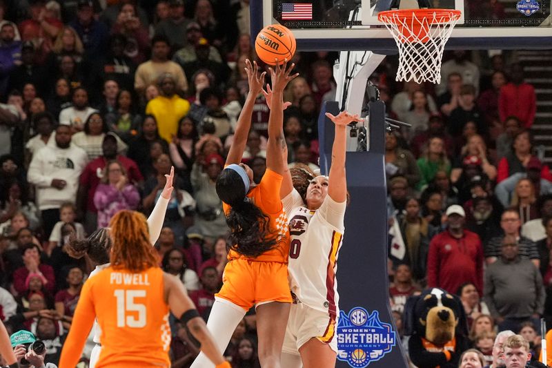 Mar 9, 2024; Greensville, SC, USA;  Tennessee Lady Vols center Tamari Key (20) shoots against South Carolina Gamecocks guard Te-Hina Paopao (0) during the second half at Bon Secours Wellness Arena. Mandatory Credit: Jim Dedmon-USA TODAY Sports