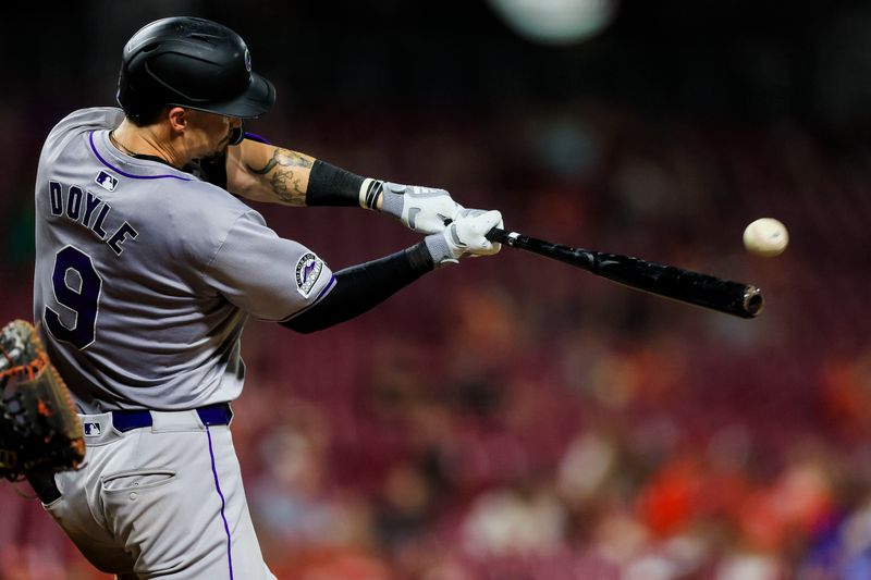 Jul 9, 2024; Cincinnati, Ohio, USA; Colorado Rockies outfielder Brenton Doyle (9) hits a solo home run in the eighth inning against the Cincinnati Reds at Great American Ball Park. Mandatory Credit: Katie Stratman-USA TODAY Sports