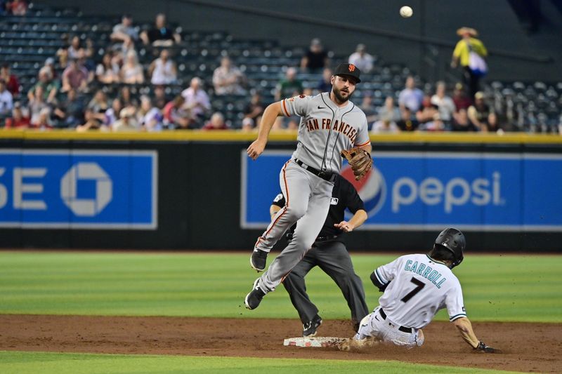 Sep 20, 2023; Phoenix, Arizona, USA;  Arizona Diamondbacks left fielder Corbin Carroll (7) steals second base against San Francisco Giants shortstop Paul DeJong (18) in the third inning at Chase Field. Mandatory Credit: Matt Kartozian-USA TODAY Sports