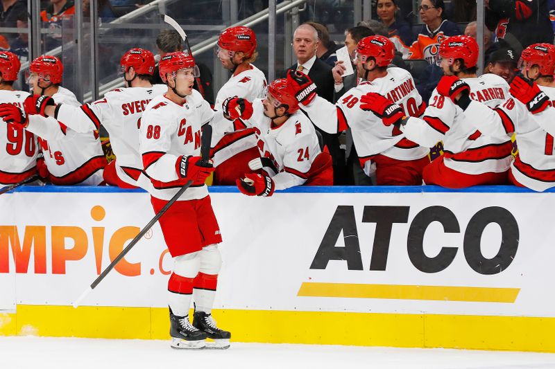 Oct 22, 2024; Edmonton, Alberta, CAN; The Carolina Hurricanes celebrate a goal scored by forward Martin Necas (88) during the third period against the Edmonton Oilers at Rogers Place. Mandatory Credit: Perry Nelson-Imagn Images