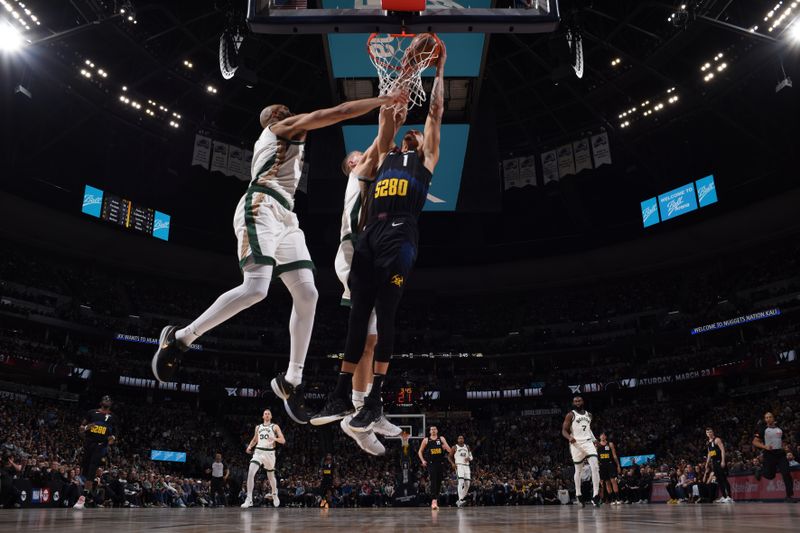 DENVER, CO - MARCH 7: Michael Porter Jr. #1 of the Denver Nuggets dunks the ball during the game against the Boston Celtics on March 7, 2024 at the Ball Arena in Denver, Colorado. NOTE TO USER: User expressly acknowledges and agrees that, by downloading and/or using this Photograph, user is consenting to the terms and conditions of the Getty Images License Agreement. Mandatory Copyright Notice: Copyright 2024 NBAE (Photo by Garrett Ellwood/NBAE via Getty Images)