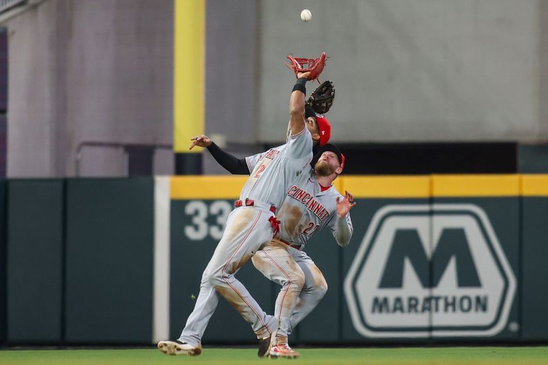 Apr 11, 2023; Atlanta, Georgia, USA; Cincinnati Reds shortstop Jose Barrero (2) catches a ball in front of left fielder Jake Fraley (27) against the Atlanta Braves in the seventh inning at Truist Park. Mandatory Credit: Brett Davis-USA TODAY Sports