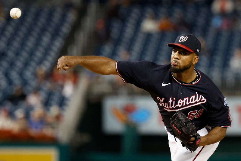 Sep 18, 2023; Washington, District of Columbia, USA; Washington Nationals starting pitcher Joan Adon (60) pitches against the Chicago White Sox during the second inning at Nationals Park. Mandatory Credit: Geoff Burke-USA TODAY Sports