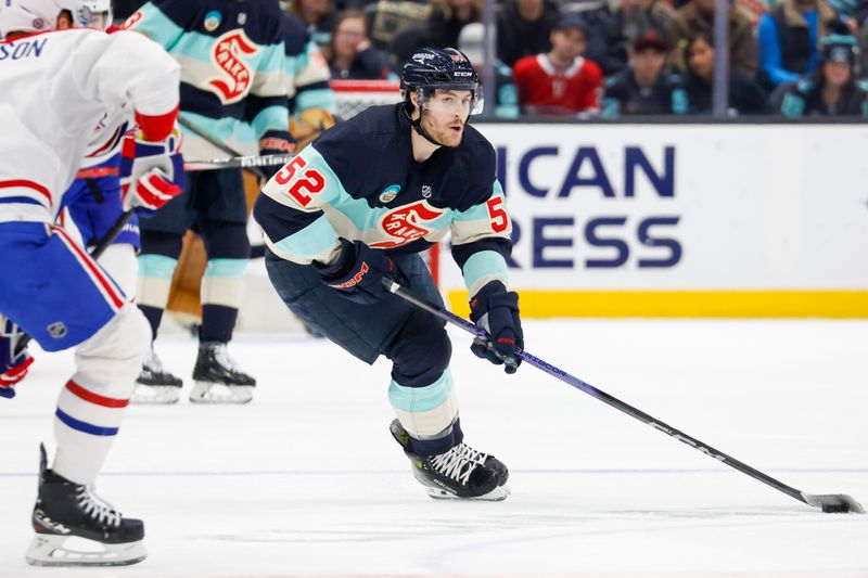 Mar 24, 2024; Seattle, Washington, USA; Seattle Kraken left wing Tye Kartye (52) skates with the puck against the Montreal Canadiens during the first period at Climate Pledge Arena. Mandatory Credit: Joe Nicholson-USA TODAY Sports