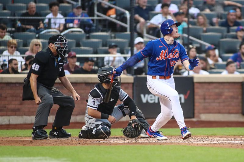 Jul 19, 2023; New York City, New York, USA;  New York Mets third baseman Brett Baty (22) hits a solo home run in the third inning against the Chicago White Sox at Citi Field. Mandatory Credit: Wendell Cruz-USA TODAY Sports