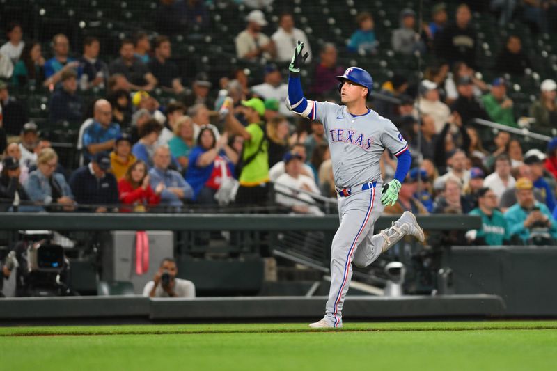 Sep 12, 2024; Seattle, Washington, USA; Texas Rangers first baseman Nathaniel Lowe (30) runs the bases after hitting a home run against the Seattle Mariners during the seventh inning at T-Mobile Park. Mandatory Credit: Steven Bisig-Imagn Images