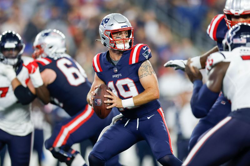 New England Patriots quarterback Trace McSorley (19) prepares to make a pass during the second half of an NFL pre-season football game against the Houston Texans, Thursday, Aug. 10, 2023, in Foxborough, Mass. (AP Photo/Greg M. Cooper)