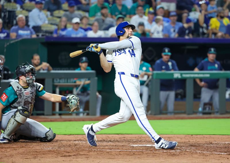 Sep 16, 2025; Kansas City, Missouri, USA; Kansas City Royals right fielder Jack Caglianone (14) hits a pop fly in the bottom of the fourth inning against the Seattle Mariners at Kauffman Stadium. Mandatory Credit: Scott Sewell-Imagn Images