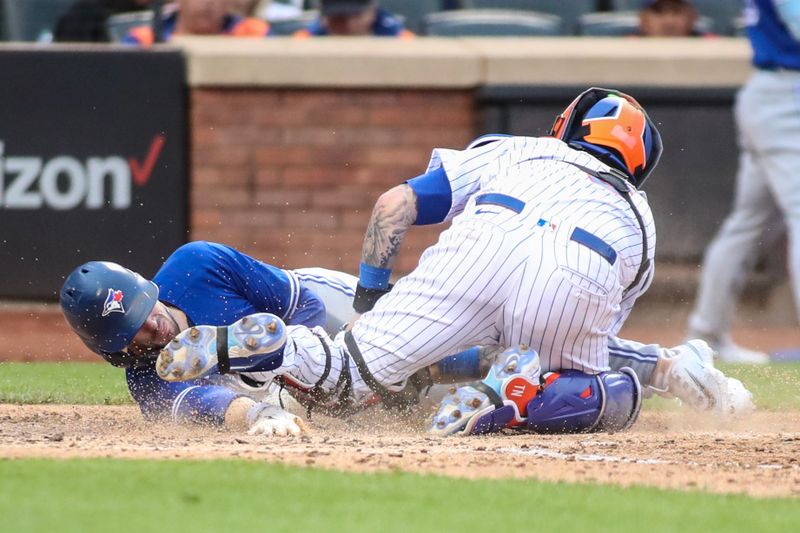 Jun 3, 2023; New York City, New York, USA;  Toronto Blue Jays pinch runner Cavan Biggio (8) is tagged out by New York Mets catcher Tomas Nido (3) in the eighth inning at Citi Field. Mandatory Credit: Wendell Cruz-USA TODAY Sports