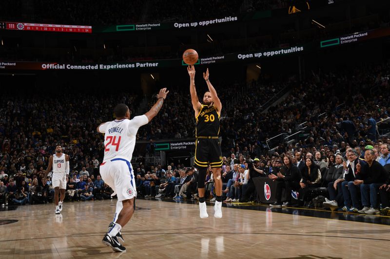 SAN FRANCISCO, CA - FEBRUARY 14: Stephen Curry #30 of the Golden State Warriors shoots a three point basket against the LA Clippers on FEBRUARY 14, 2024 at Chase Center in San Francisco, California. NOTE TO USER: User expressly acknowledges and agrees that, by downloading and or using this photograph, user is consenting to the terms and conditions of Getty Images License Agreement. Mandatory Copyright Notice: Copyright 2024 NBAE (Photo by Noah Graham/NBAE via Getty Images)