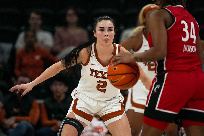 Jan 27, 2024; Austin, TX, USA; Texas Longhorns guard Shaylee Gonzales (2) pressures Cincinnati Bearcats guard A'riel Jackson (34) during a game at the Moody Center. Mandatory Credit: Aaron E. Martinez/American-Statesman via USA TODAY NETWORK