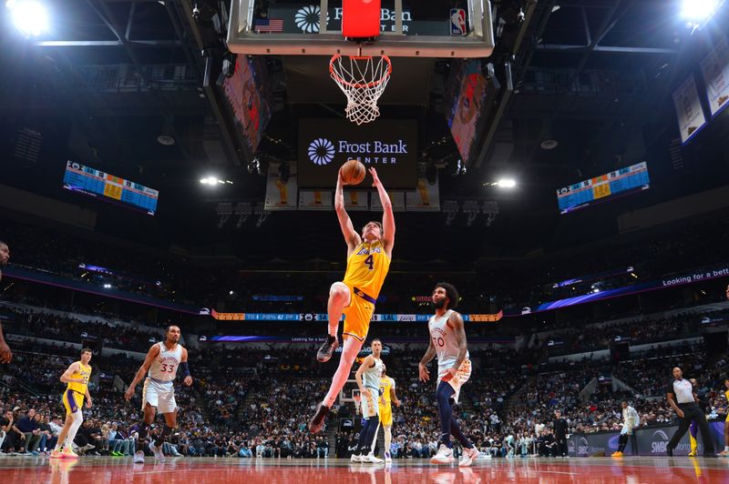 SAN ANTONIO, TX - NOVEMBER 27: Dalton Knecht #4 of the Los Angeles Lakers drives to the basket during the game against the San Antonio Spurs on November 27, 2024 at the Frost Bank Center in San Antonio, Texas. NOTE TO USER: User expressly acknowledges and agrees that, by downloading and or using this photograph, user is consenting to the terms and conditions of the Getty Images License Agreement. Mandatory Copyright Notice: Copyright 2024 NBAE (Photos by Michael Gonzales/NBAE via Getty Images)