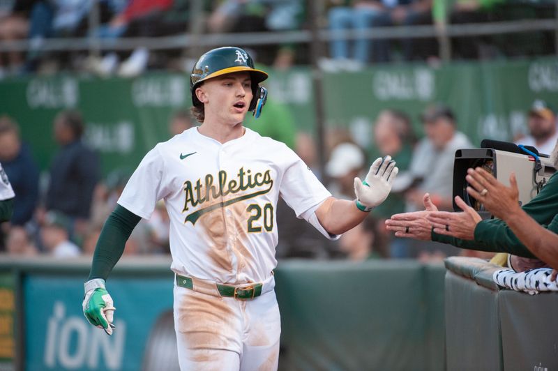 Jun 18, 2024; Oakland, California, USA; Oakland Athletics second base Zack Gelof (20) celebrates with team mates after hitting a home run against the Kansas City Royals during the fourth inning at Oakland-Alameda County Coliseum. Mandatory Credit: Ed Szczepanski-USA TODAY Sports