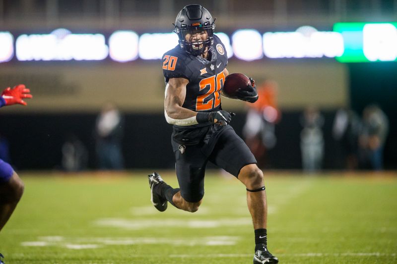 Nov 13, 2021; Stillwater, Oklahoma, USA; Oklahoma State Cowboys running back Dominic Richardson (20) runs the ball during the third quarter against the TCU Horned Frogs at Boone Pickens Stadium. Mandatory Credit: Brett Rojo-USA TODAY Sports