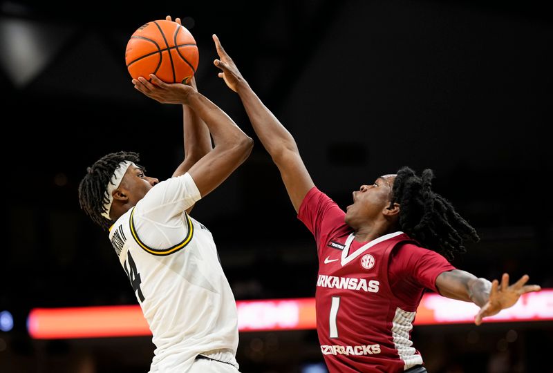 Jan 31, 2024; Columbia, Missouri, USA; Missouri Tigers guard Anthony Robinson II (14) shoots against Arkansas Razorbacks guard Keyon Menifield Jr. (1) during the first half at Mizzou Arena. Mandatory Credit: Jay Biggerstaff-USA TODAY Sports