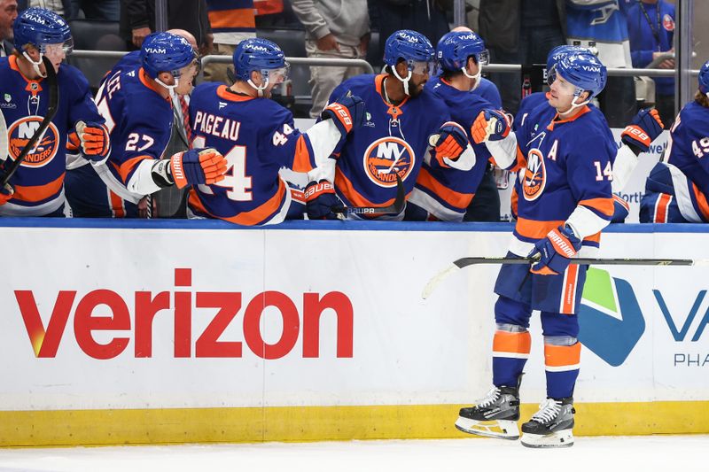 Oct 16, 2025; Elmont, New York, USA; New York Islanders center Bo Horvat (14) celebrates with his teammates after scoring a goal in the third period against the Edmonton Oilers at UBS Arena. Mandatory Credit: Wendell Cruz-Imagn Images