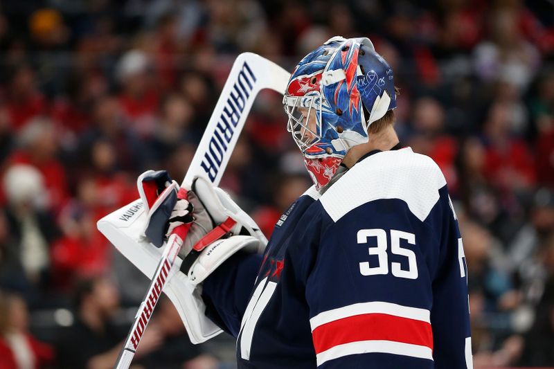 Jan 7, 2024; Washington, District of Columbia, USA; Washington Capitals goaltender Darcy Kuemper (35) checks his stick during a stoppage in play in the third period against the Los Angeles Kings at Capital One Arena. Mandatory Credit: Amber Searls-USA TODAY Sports