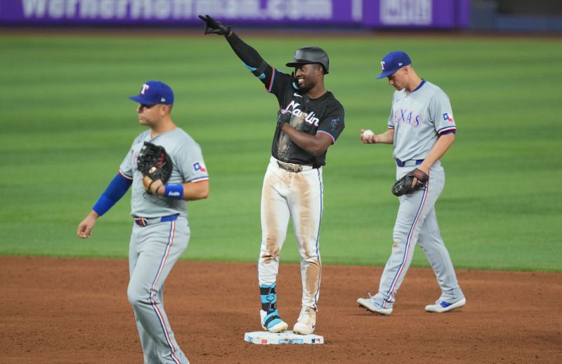 May 31, 2024; Miami, Florida, USA;  Miami Marlins right fielder Jesús Sánchez (12) celebrates a double in the fifth inning against the Texas Rangers at loanDepot Park. Mandatory Credit: Jim Rassol-USA TODAY Sports