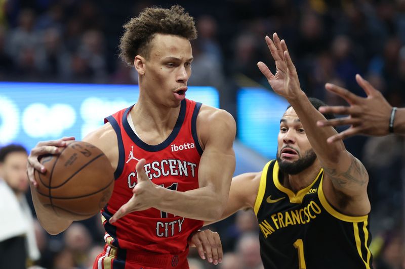 SAN FRANCISCO, CALIFORNIA - JANUARY 10: Dyson Daniels #11 of the New Orleans Pelicans is guarded by Cory Joseph #1 of the Golden State Warriors in the first half at Chase Center on January 10, 2024 in San Francisco, California. NOTE TO USER: User expressly acknowledges and agrees that, by downloading and or using this photograph, User is consenting to the terms and conditions of the Getty Images License Agreement.  (Photo by Ezra Shaw/Getty Images)