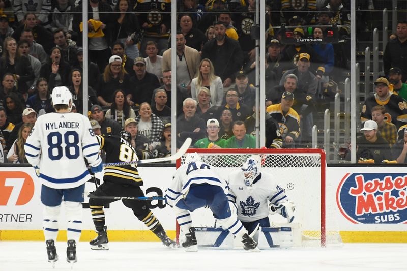 May 4, 2024; Boston, Massachusetts, USA; Boston Bruins right wing David Pastrnak (88) scores the game winning goal past Toronto Maple Leafs goaltender Ilya Samsonov (35) in overtime in game seven of the first round of the 2024 Stanley Cup Playoffs at TD Garden. Mandatory Credit: Bob DeChiara-USA TODAY Sports