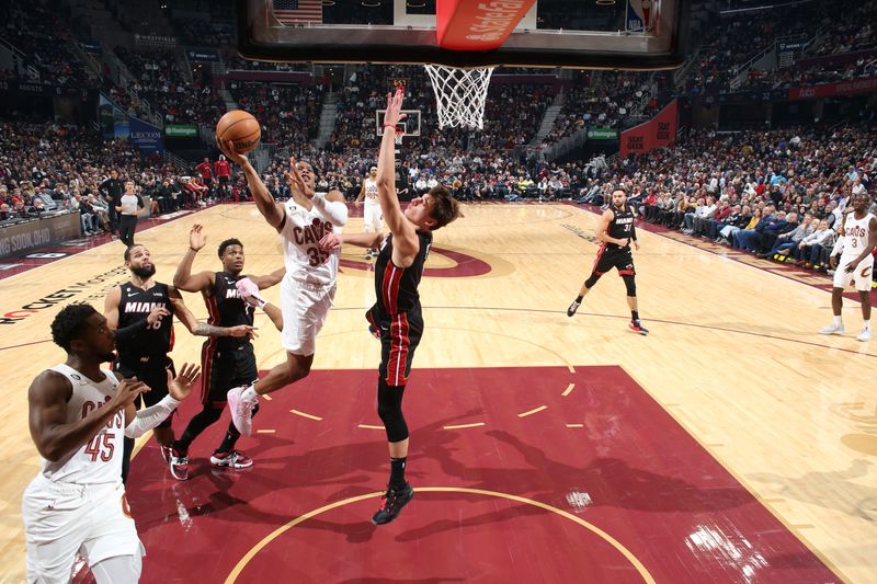 CLEVELAND, OH - NOVEMBER 20: Isaac Okoro #35 of the Cleveland Cavaliers drives to the basket during the game against the Miami Heat on November 20, 2022 at Rocket Mortgage Fieldhouse in Cleveland, Ohio. NOTE TO USER: User expressly acknowledges and agrees that, by downloading and or using this photograph, User is consenting to the terms and conditions of the Getty Images License Agreement. Mandatory Copyright Notice: Copyright 2022 NBAE (Photo by Joe Murphy/NBAE via Getty Images)