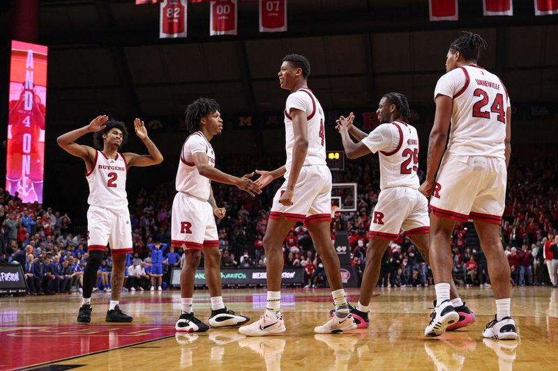 Jan 13, 2025; Piscataway, New Jersey, USA; Rutgers Scarlet Knights guard Jeremiah Williams (25) celebrates with teammates as making a basket during the second half against the UCLA Bruins at Jersey Mike's Arena. Mandatory Credit: Vincent Carchietta-Imagn Images