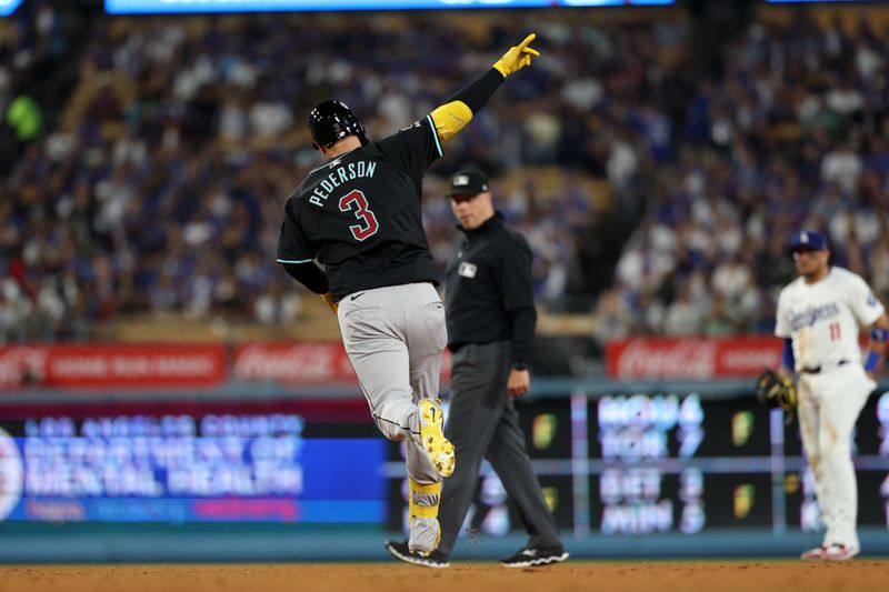 Jul 2, 2024; Los Angeles, California, USA;  Arizona Diamondbacks designated hitter Joc Pederson (3) reacts after hitting a home run during the ninth inning against the Los Angeles Dodgers at Dodger Stadium. Mandatory Credit: Kiyoshi Mio-USA TODAY Sports