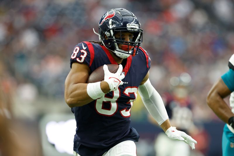 Houston Texans tight end O.J. Howard (83) carries the ball after a reception during an NFL football game against the Jacksonville Jaguars on Sunday, January 1, 2023, in Houston. (AP Photo/Matt Patterson)