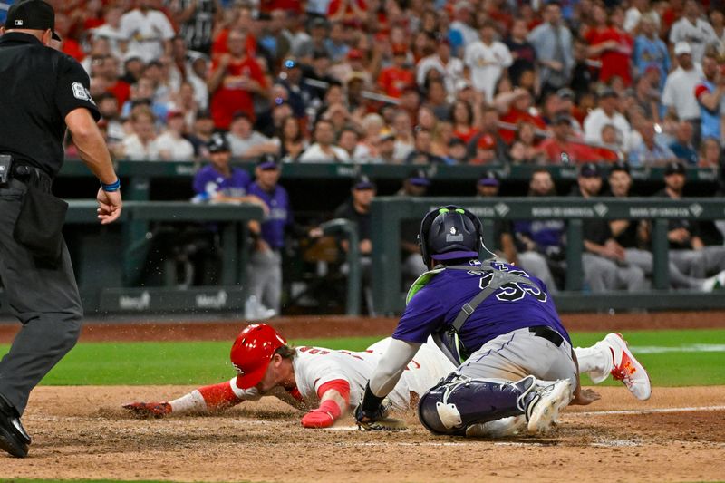 Jun 6, 2024; St. Louis, Missouri, USA;  St. Louis Cardinals second baseman Nolan Gorman (16) slides safely past Colorado Rockies catcher Elias Diaz (35) during the sixth inning at Busch Stadium. Mandatory Credit: Jeff Curry-USA TODAY Sports