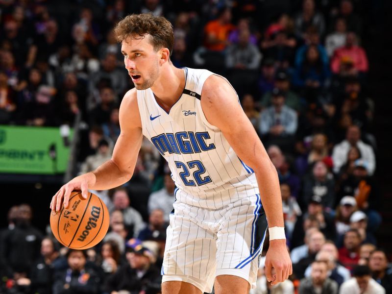 PHOENIX, AZ - NOVEMBER 18: Franz Wagner #22 of the Orlando Magic dribbles the ball during the game against the Phoenix Suns on November 18, 2024 at Footprint Center in Phoenix, Arizona. NOTE TO USER: User expressly acknowledges and agrees that, by downloading and or using this photograph, user is consenting to the terms and conditions of the Getty Images License Agreement. Mandatory Copyright Notice: Copyright 2024 NBAE (Photo by Barry Gossage/NBAE via Getty Images)