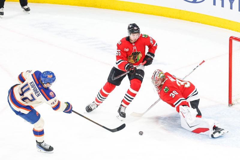 Jan 12, 2026; Chicago, Illinois, USA; Edmonton Oilers right wing Kasperi Kapanen (42) shoots against Chicago Blackhawks goaltender Spencer Knight (30) during the first period at United Center. Mandatory Credit: Kamil Krzaczynski-Imagn Images