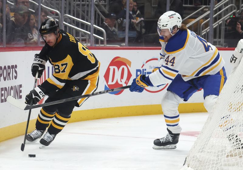 Nov 26, 2025; Pittsburgh, Pennsylvania, USA;  Pittsburgh Penguins center Sidney Crosby (87) moves the puck against Buffalo Sabres center Josh Dunne (44) during the second period at PPG Paints Arena. Mandatory Credit: Charles LeClaire-Imagn Images