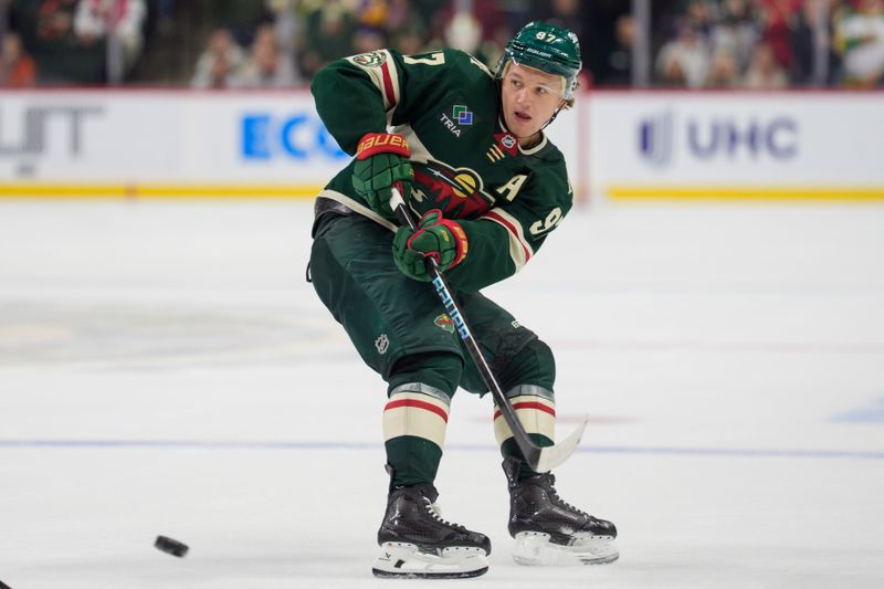 Oct 13, 2025; Saint Paul, Minnesota, USA; Minnesota Wild left wing Kirill Kaprizov (97) passes to a teammate in overtime against the Los Angeles Kings˜ at Grand Casino Arena. Mandatory Credit: Matt Blewett-Imagn Images