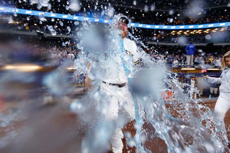 Sep 11, 2023; Milwaukee, Wisconsin, USA;  Milwaukee Brewers pitcher Brandon Woodruff (53) gets dunked with Gatorade following the game against the Miami Marlins at American Family Field. Mandatory Credit: Jeff Hanisch-USA TODAY Sports
