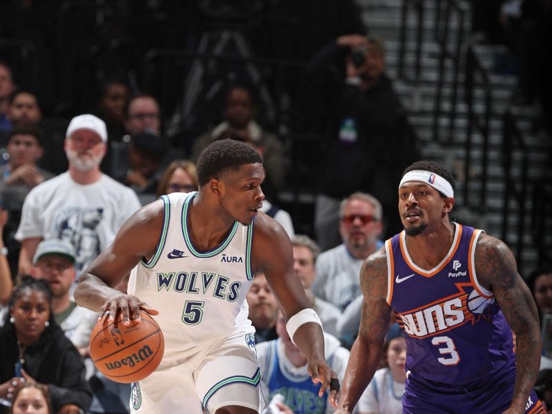 MINNEAPOLIS, MN -  APRIL 23: Anthony Edwards #5 of the Minnesota Timberwolves dribbles the ball during the game against the Phoenix Suns during Round 1 Game 2 of the 2024 NBA Playoffs on April 23, 2024 at Target Center in Minneapolis, Minnesota. NOTE TO USER: User expressly acknowledges and agrees that, by downloading and or using this Photograph, user is consenting to the terms and conditions of the Getty Images License Agreement. Mandatory Copyright Notice: Copyright 2024 NBAE (Photo by David Sherman/NBAE via Getty Images)