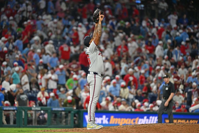 Aug 31, 2025; Philadelphia, Pennsylvania, USA; Atlanta Braves pitcher Raisel Iglesias (26) celebrates final out in win against the Philadelphia Phillies at Citizens Bank Park. Mandatory Credit: Eric Hartline-Imagn Images