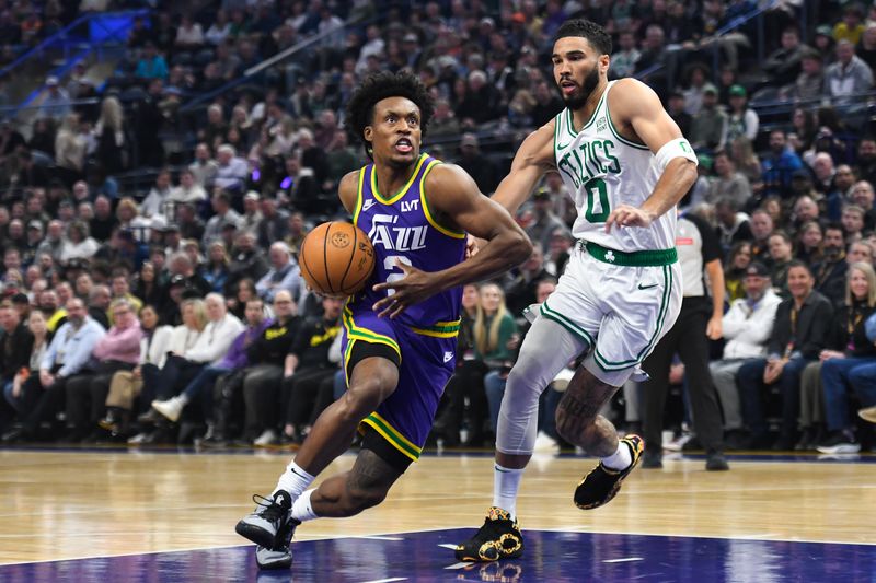 SALT LAKE CITY, UTAH - MARCH 12: Collin Sexton #2 of the Utah Jazz drives into Jayson Tatum #0 of the Boston Celtics during the first half of a game at Delta Center on March 12, 2024 in Salt Lake City, Utah. NOTE TO USER: User expressly acknowledges and agrees that, by downloading and or using this photograph, User is consenting to the terms and conditions of the Getty Images License Agreement. (Photo by Alex Goodlett/Getty Images)